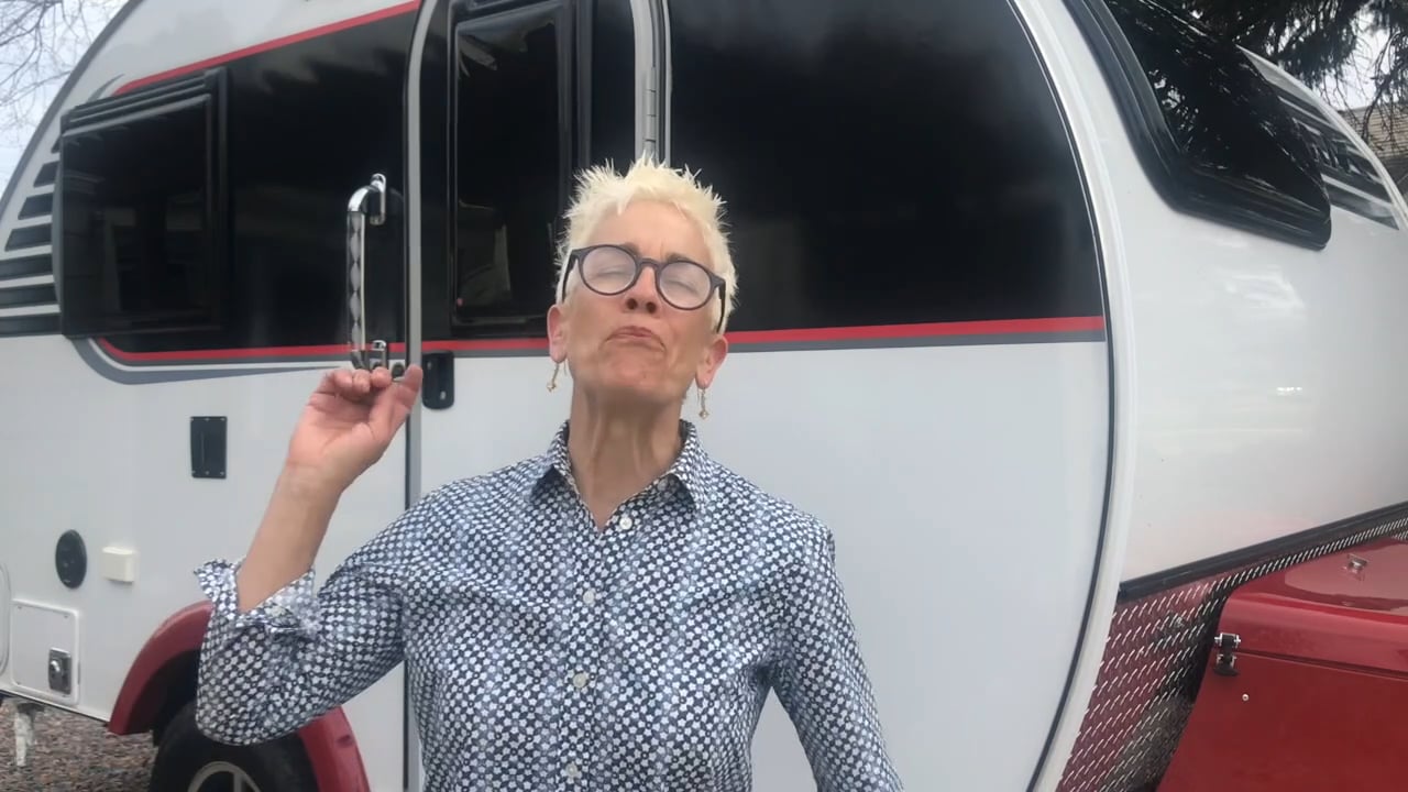 Patti Dobrowolski in front of her wife's camper