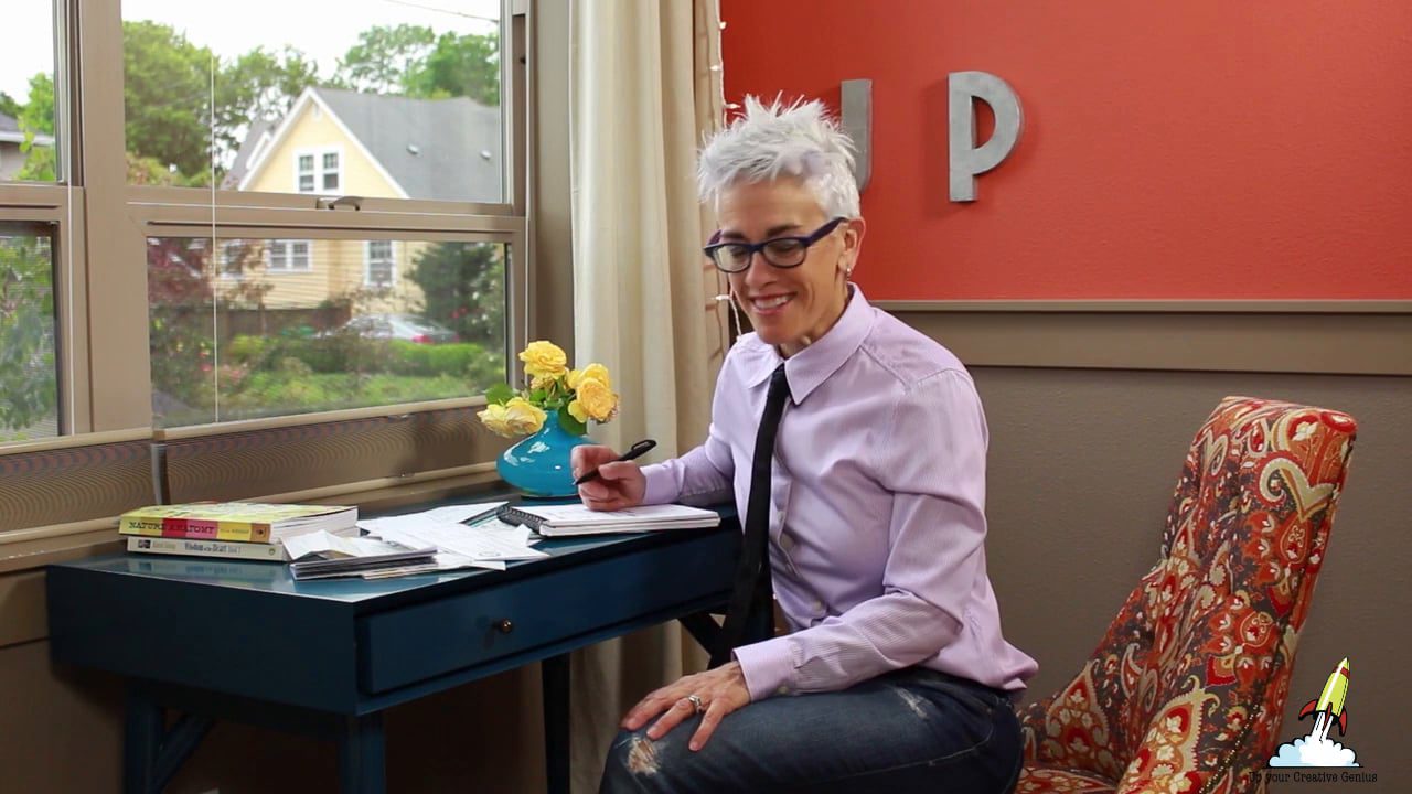 Patti Dobrowolski sitting at a blue desk